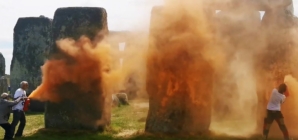 Stonehenge sprayed oranged by climate protesters