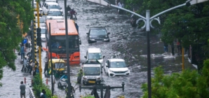 Floods and landslides triggered by heavy rains kill at least 16 people in India