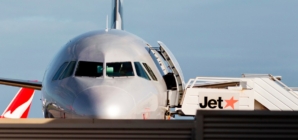 Man arrested at airport after opening plane door and walking on wing