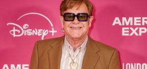 Elton John wears his old kneecap as a pendant around his neck following latest health scare