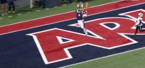 Arizona's Tetairoa McMillan goes long for a 33-yard touchdown reception to take a 7-0 lead over Houston