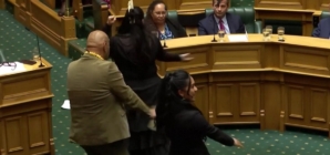 Maori lawmakers perform a haka to protest against Indigenous treaty bill