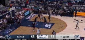 Solo Ball throws down a one-handed slam to give No. 11 UConn a 50-48 lead over Xavier