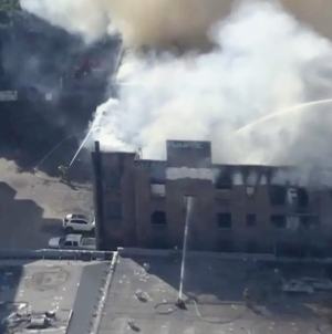 Firefighters battle blaze, help homeless people evacuate vacant 4-story building in downtown L.A.