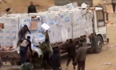 Video shows Palestinians in Gaza dragging aid supplies off trucks