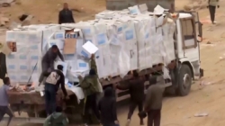 Video shows Palestinians in Gaza dragging aid supplies off trucks