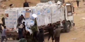 Video shows Palestinians in Gaza dragging aid supplies off trucks