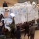 Video shows Palestinians in Gaza dragging aid supplies off trucks