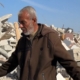 Rafah resident searches the wreckage of his home for a keepsake