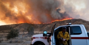 As Hughes fire swells, nearby residents take in the flames