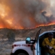 As Hughes fire swells, nearby residents take in the flames