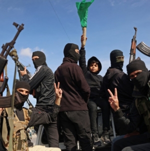 Armed Hamas militants celebrate ceasefire deal in Gaza