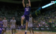 Wilhelm Breidenbach throws down a two-handed slam dunk, extending Washington's lead over Oregon