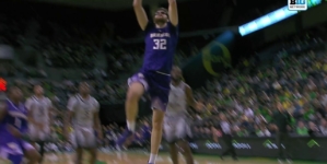 Wilhelm Breidenbach throws down a two-handed slam dunk, extending Washington's lead over Oregon