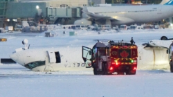 Passenger on flipped Delta jet in Toronto recalls being upside down, ‘hanging from our seatbelts’