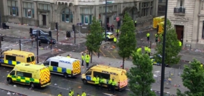 Emergency crews respond to reports a car hit pedestrians during soccer parade