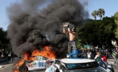 Waymo vehicles set on fire in downtown L.A, as protesters, police clash