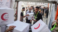 Israel halts aid, official says, as Palestinian clans in Gaza deny Hamas is stealing it