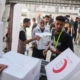 Israel halts aid, official says, as Palestinian clans in Gaza deny Hamas is stealing it