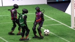 Humanoid robots play soccer in China