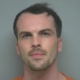 Man who killed ex in front of her son, kept voodoo doll, and defaced photos of her is sentenced