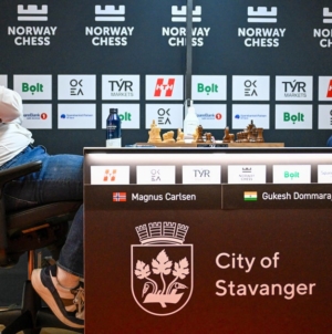 Magnus Carlsen, No. 1 ranked chess player, slams fist onto table after losing to world champ Gukesh Dommaraju