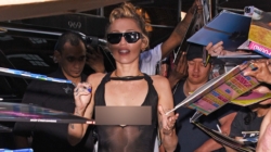 Miley Cyrus goes braless in sheer black dress during album promotion