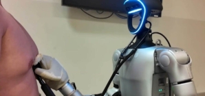 Humanoid robot performs medical procedures via remote control