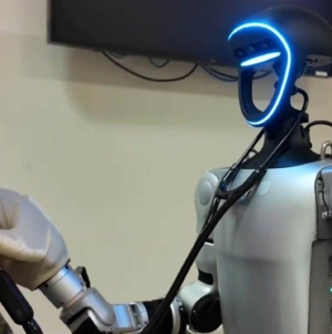 Humanoid robot performs medical procedures via remote control