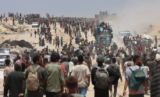 The food is just outside the border. But getting it to Gaza’s starving is a chaotic process