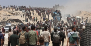The food is just outside the border. But getting it to Gaza’s starving is a chaotic process