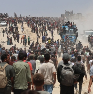 The food is just outside the border. But getting it to Gaza’s starving is a chaotic process