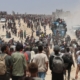 The food is just outside the border. But getting it to Gaza’s starving is a chaotic process