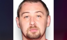 3 people charged amid search for suspect accused of killing 4 family members and abandoning baby