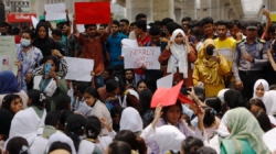 Grief and anger in Bangladesh as death toll from military training jet’s crash into school hits 31