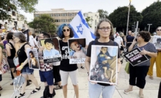 Protesters in Israel show pictures of starving Gazan children