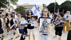 Protesters in Israel show pictures of starving Gazan children