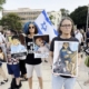 Protesters in Israel show pictures of starving Gazan children