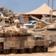 Satellite images show Israel building up forces for a possible ground invasion of Gaza, sources say