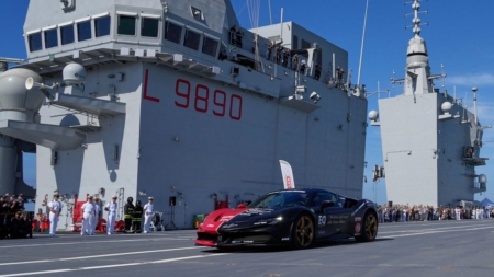 Man in a Ferrari on an aircraft carrier attempts to set record for fastest car driven on a boat