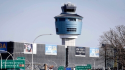 Plane taxiing at LaGuardia Airport is clipped by another jet on the ground