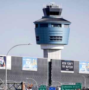 Plane taxiing at LaGuardia Airport is clipped by another jet on the ground