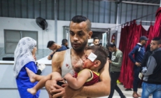 Israel says Gaza ceasefire back on after more than 100 reported killed in strikes