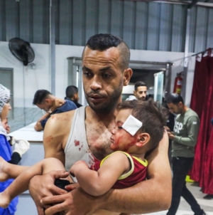 Israel says Gaza ceasefire back on after more than 100 reported killed in strikes