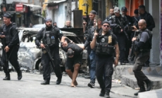 Raid on gang in Rio de Janeiro leaves over 100 people dead, including police officers, officials say