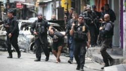 Raid on gang in Rio de Janeiro leaves over 100 people dead, including police officers, officials say