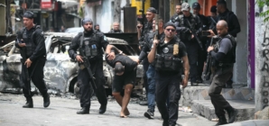 Raid on gang in Rio de Janeiro leaves over 100 people dead, including police officers, officials say