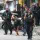 Raid on gang in Rio de Janeiro leaves over 100 people dead, including police officers, officials say