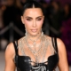 Kim Kardashian ditches face mask, shows off racy sheer dress in London