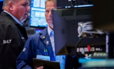 Dow slides nearly 800 points as AI and tariff risks rattle investors